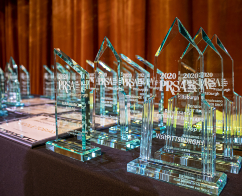 Acrylic awards on display table onstage at 2020 Rennaissance Awards